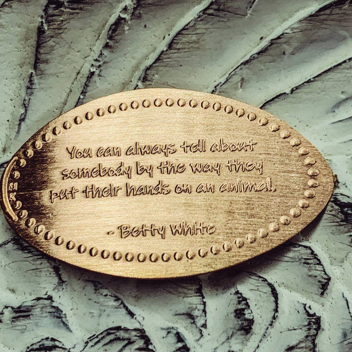 Betty White - You can always tell about somebody by the way they put their hands on an animal